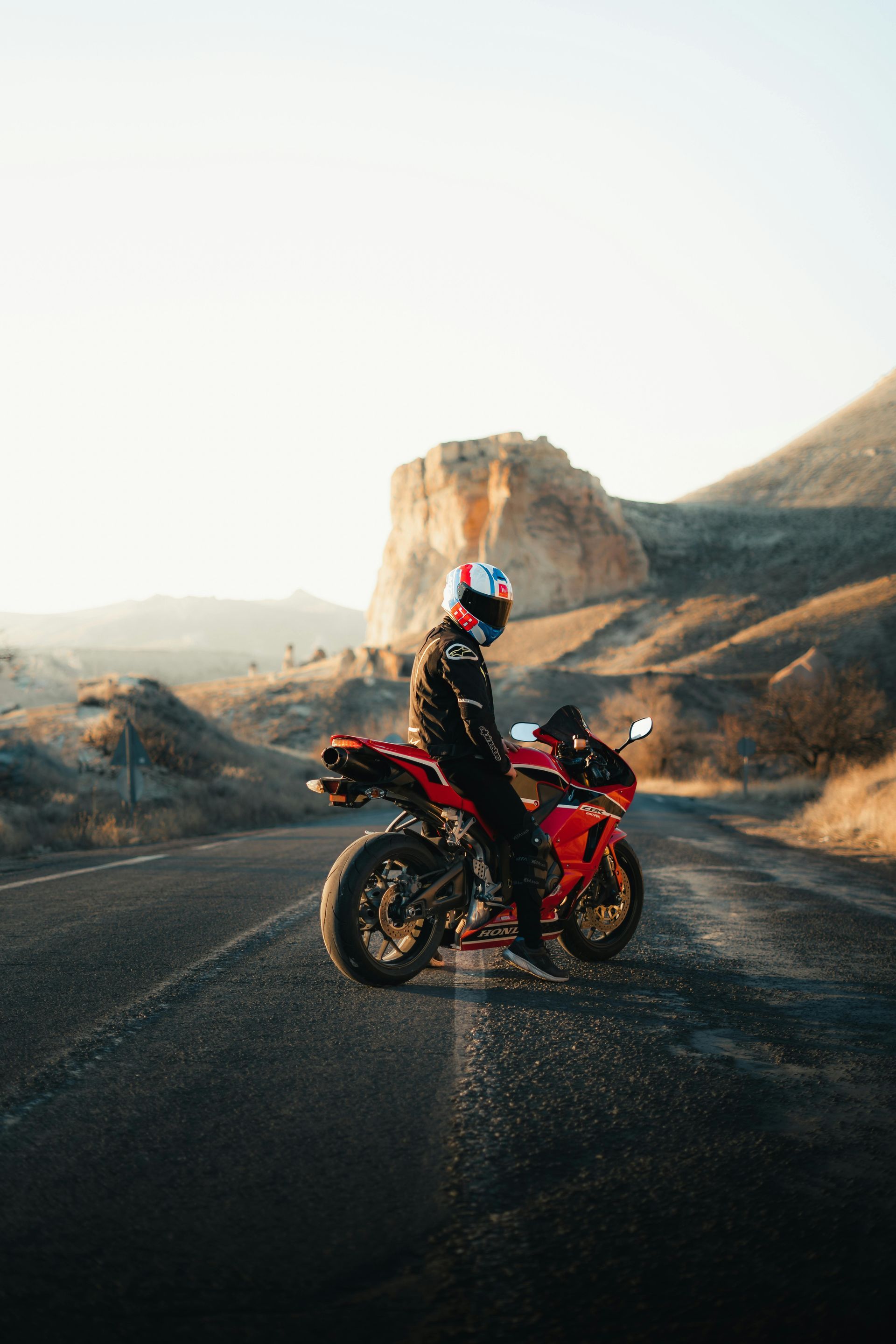 A person is riding a motorcycle on a track.