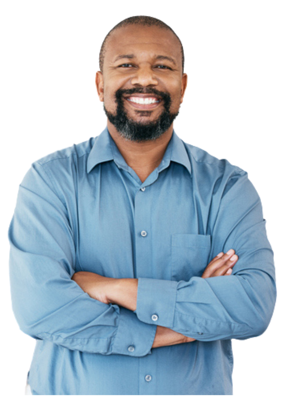 A man in a blue shirt is smiling with his arms crossed