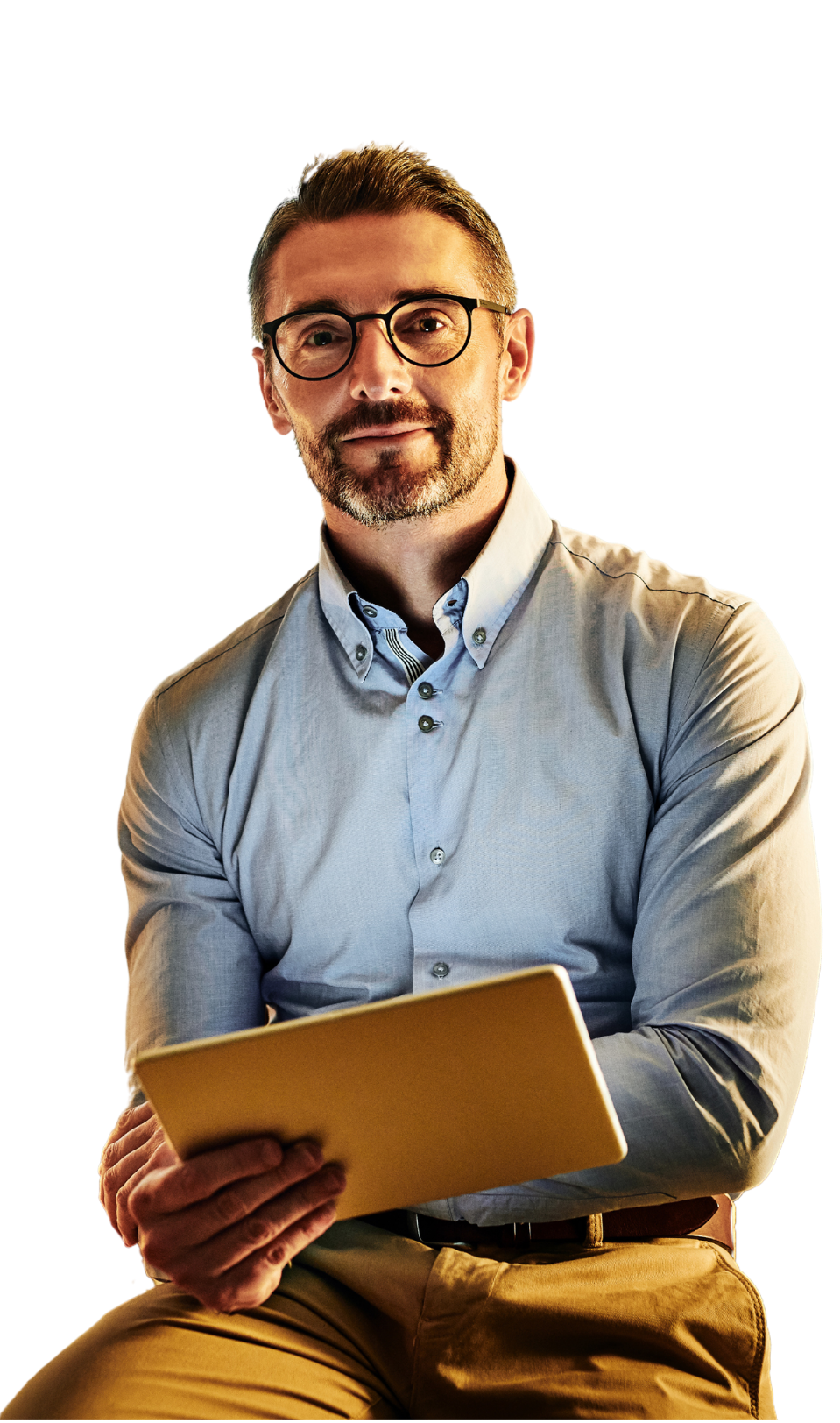 A man is sitting down holding a tablet in his hands.