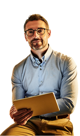 A man is sitting down holding a tablet in his hands.