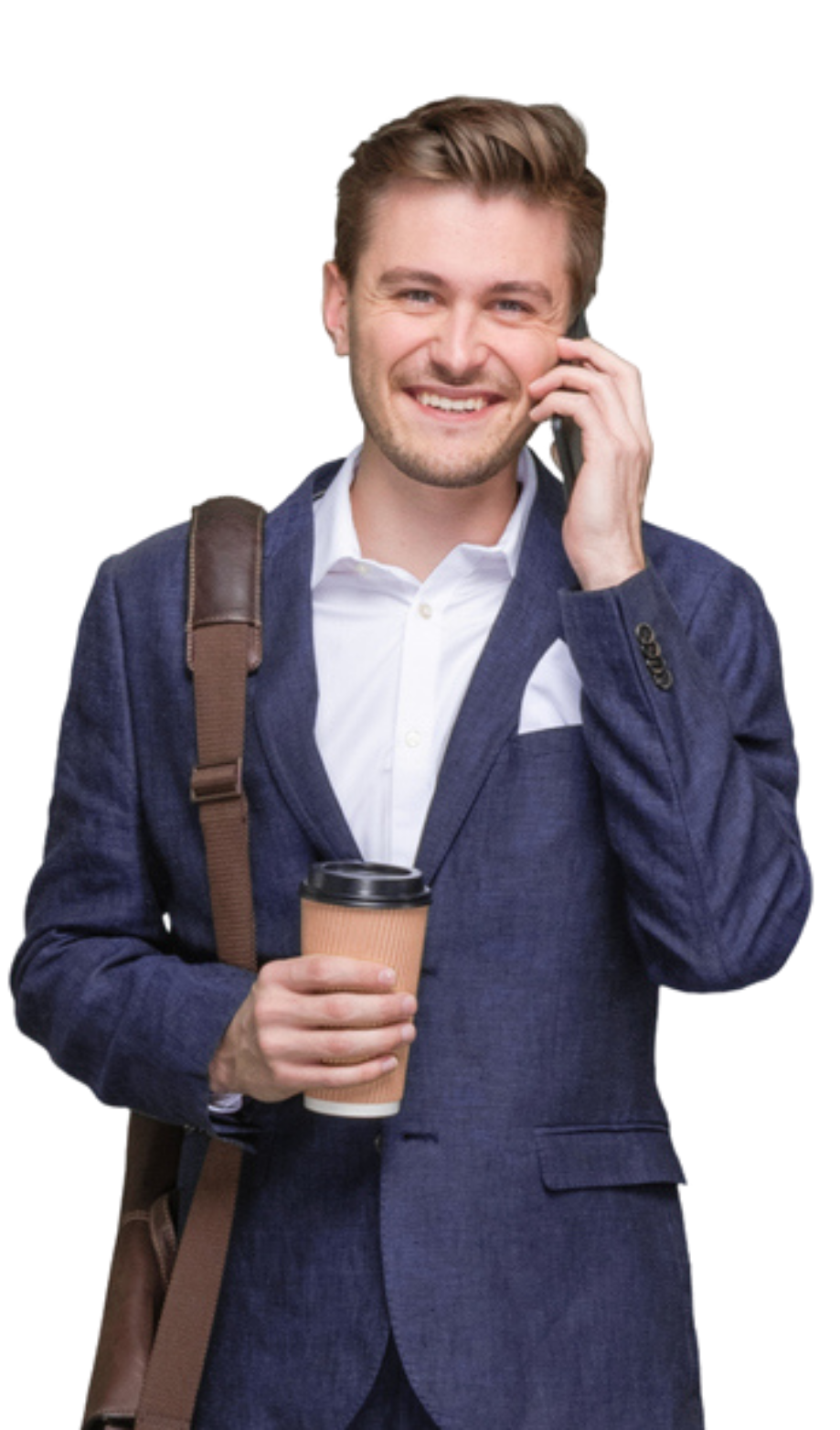 A man in a suit is talking on a cell phone while holding a cup of coffee.