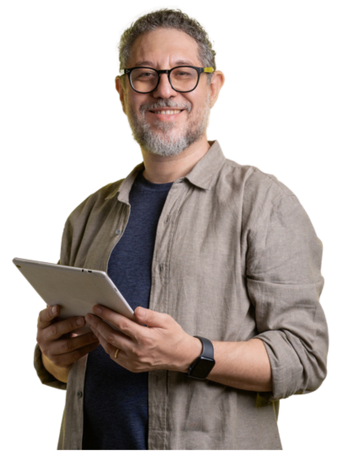 A man wearing glasses is holding a tablet in his hands