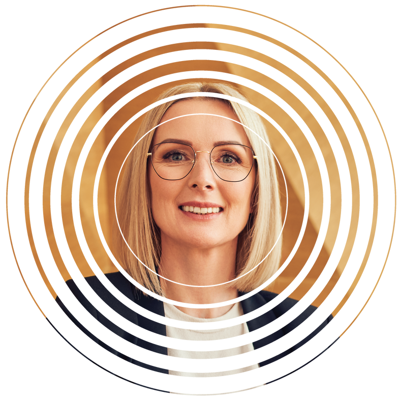 A woman wearing glasses is smiling in a circle.