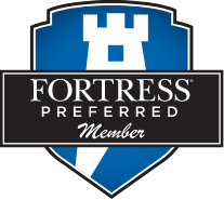 the fortress preferred member logo is a blue and black shield with a castle on it .