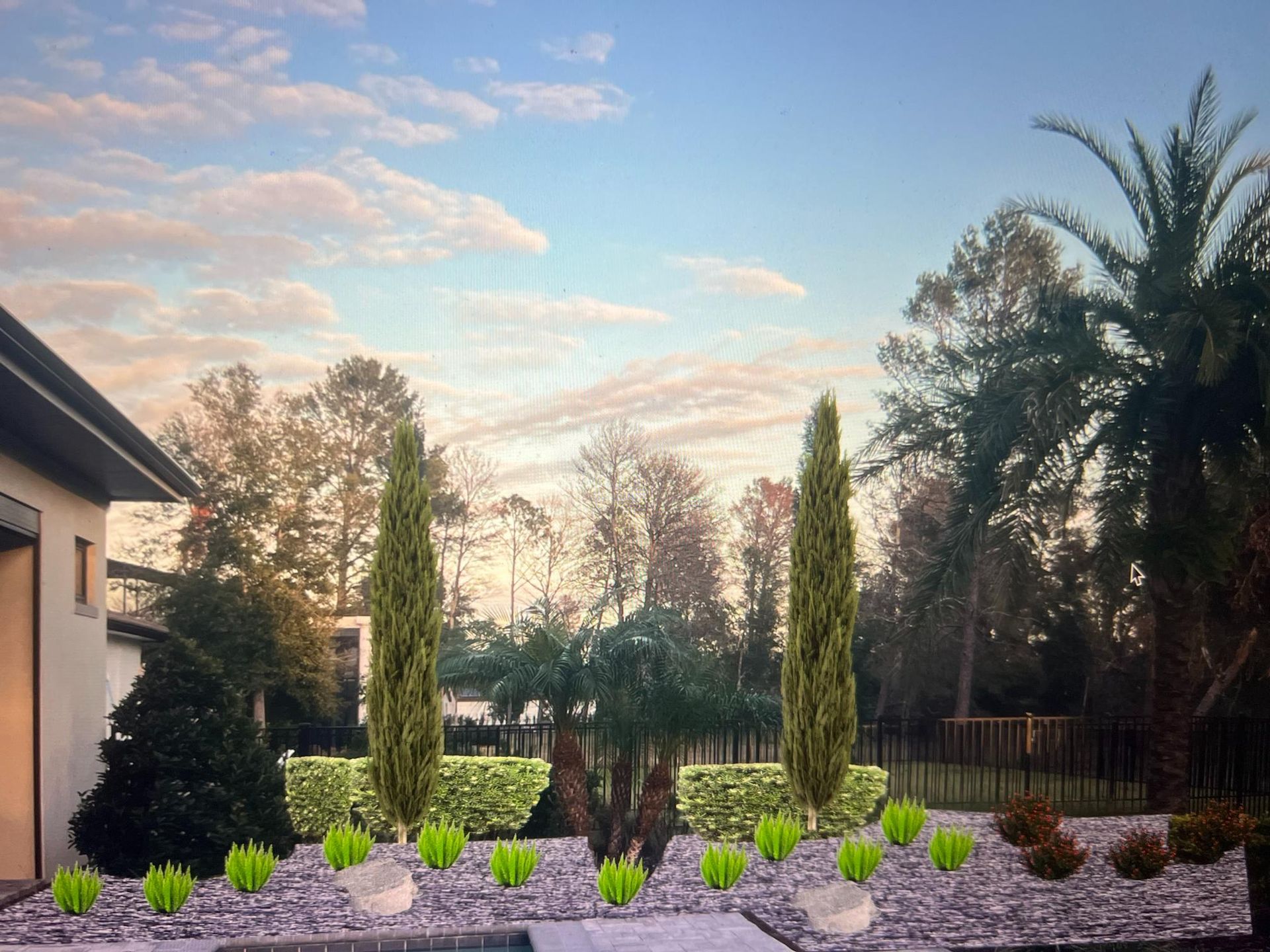 Landscaped backyard with trees and shrubs; cypress trees flank a central garden.