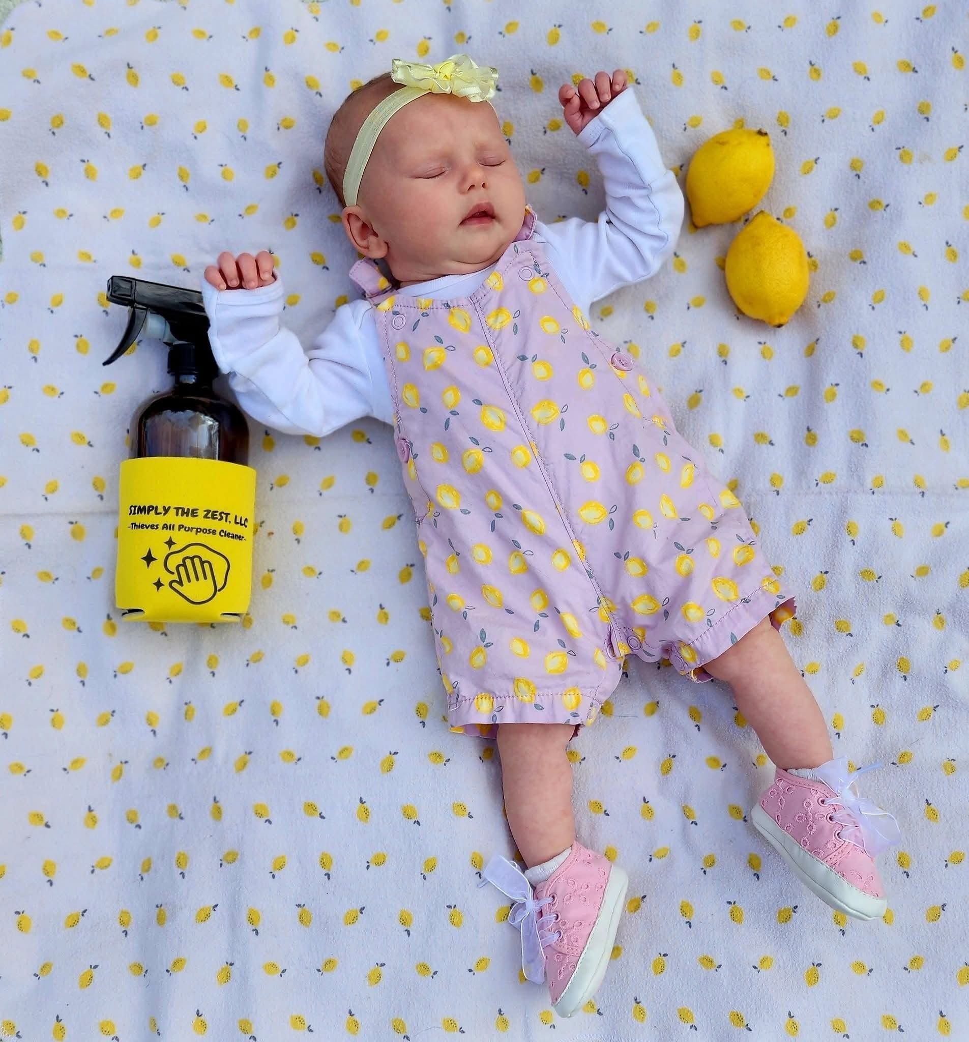 Woman with light brown hair smiles, wearing a green shirt, white background.