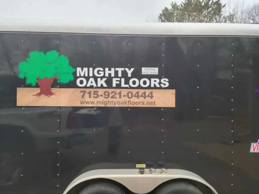 A trailer with mighty oak floors written on it