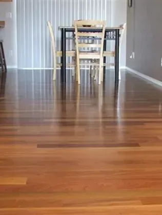A dining room with a table and chairs in it.
