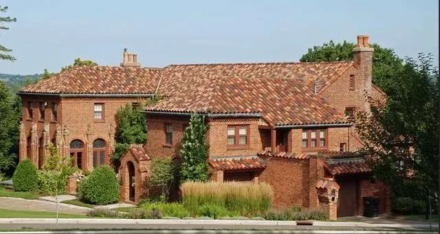 A large brick house with a tiled roof