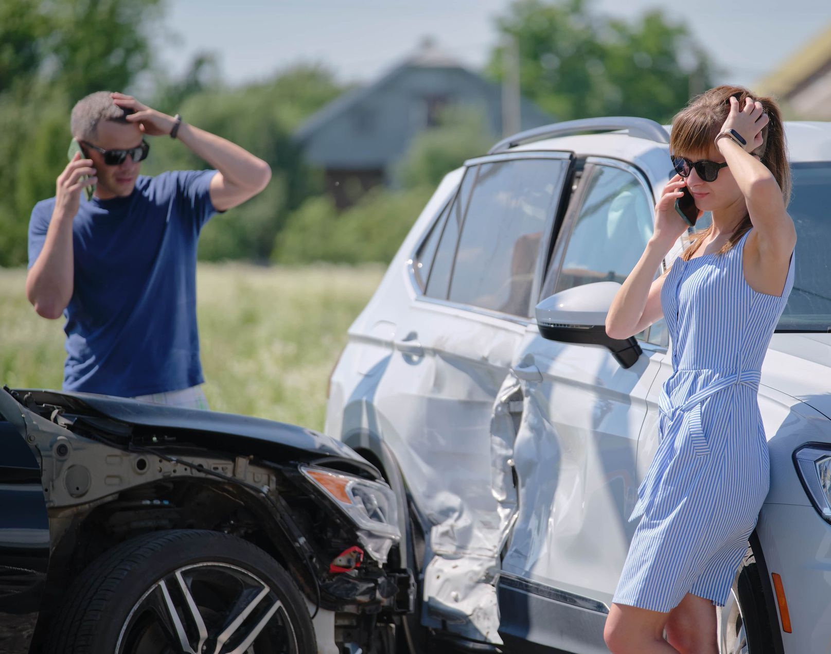 man and women making a call after a vehicle collision