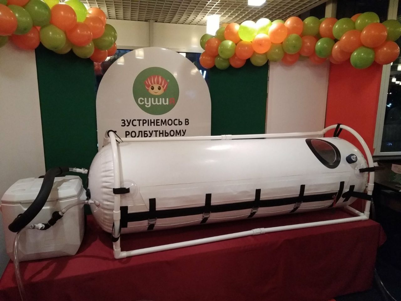 A white cylindrical chamber with attached equipment.