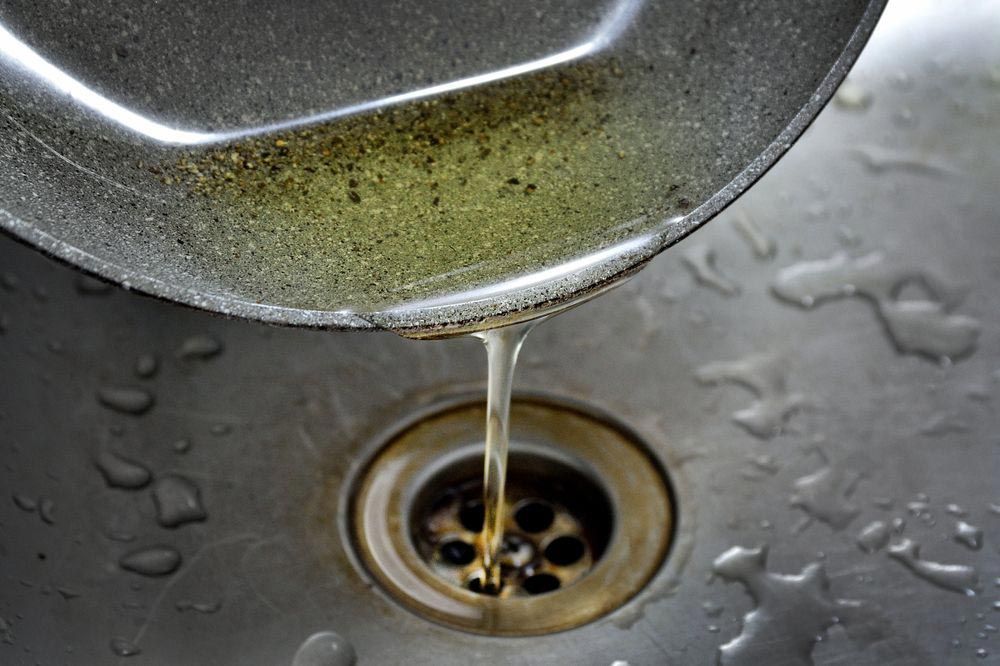 Pouring Oil On The Sink