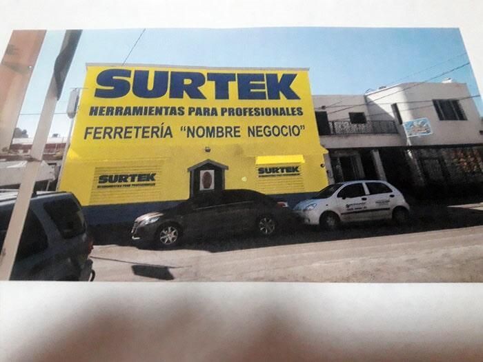 Un cartel amarillo que dice surtek.