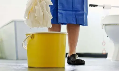 Wetting A Mop — Schenectady, NY — Paige's Janitorial Cleaning Service and Floor Care