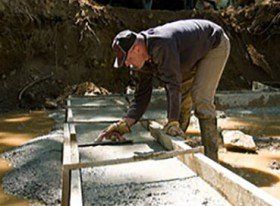 Man Cementing a Floor — Worker's Compensation in Watkinsville, GA