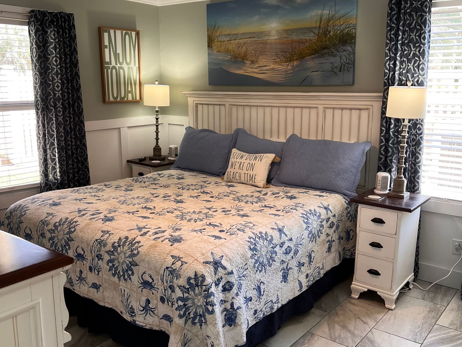 A hotel room with two beds and a chair