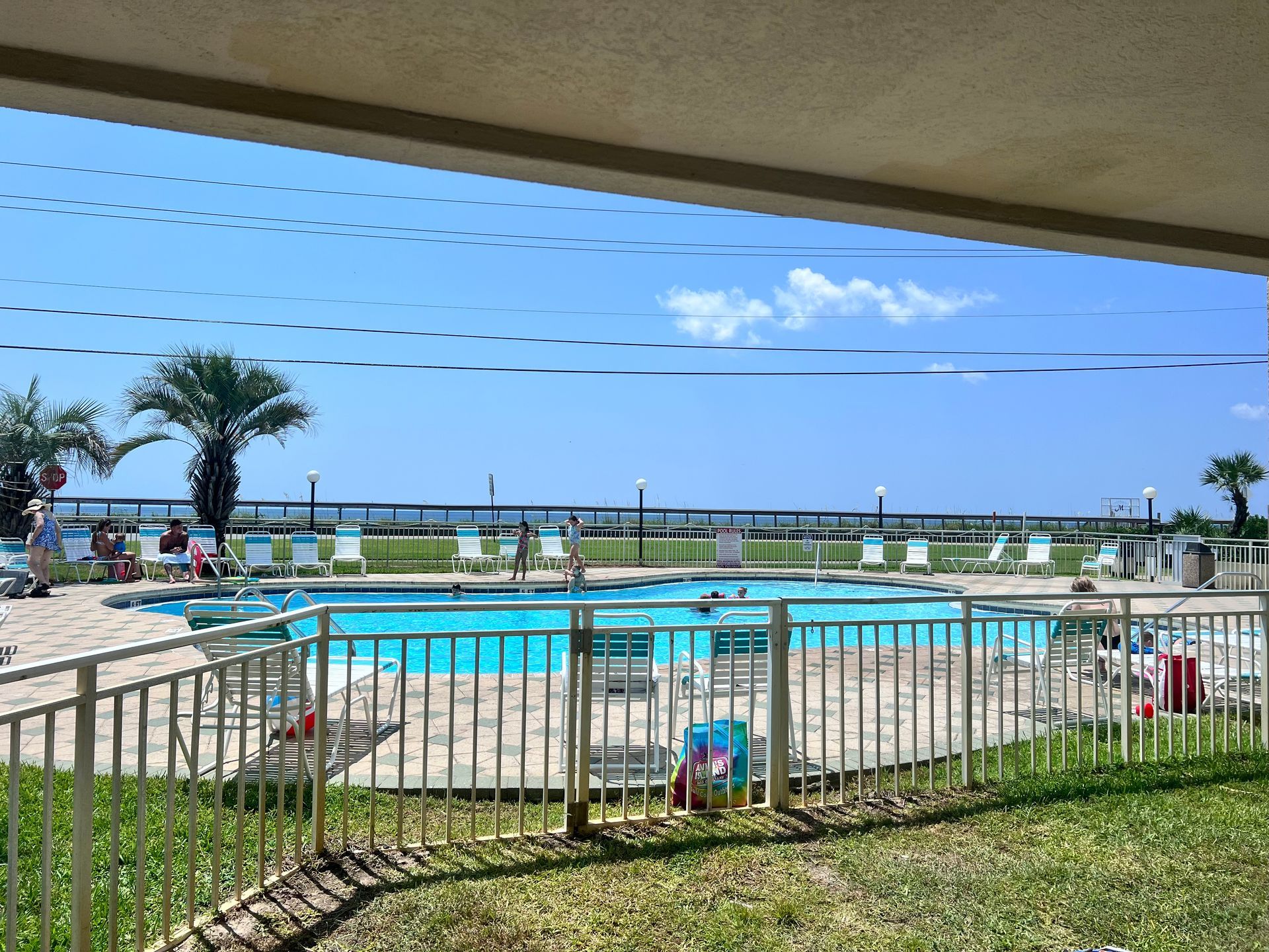 A large swimming pool with a fence around it