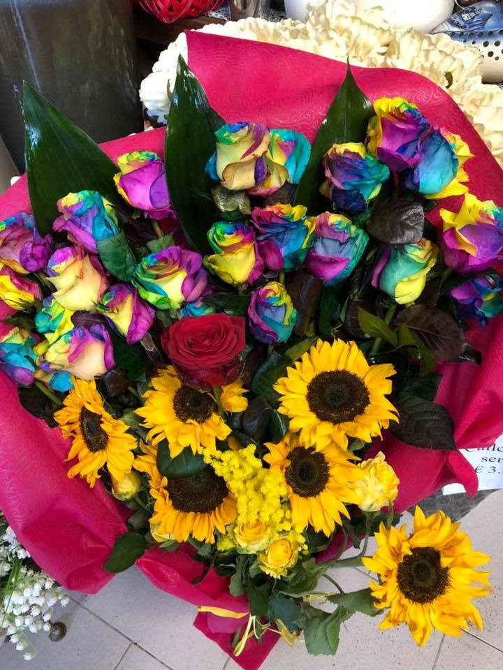 Bouquet with sunflowers and coloured flowers