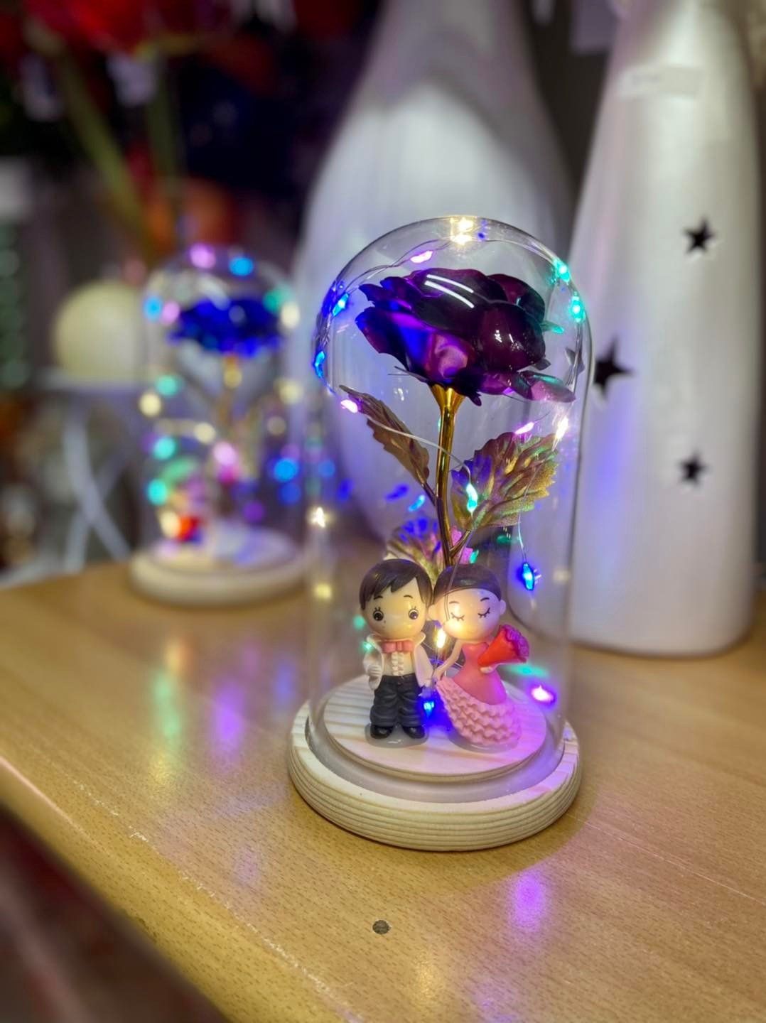 Glass flowers with figurines
