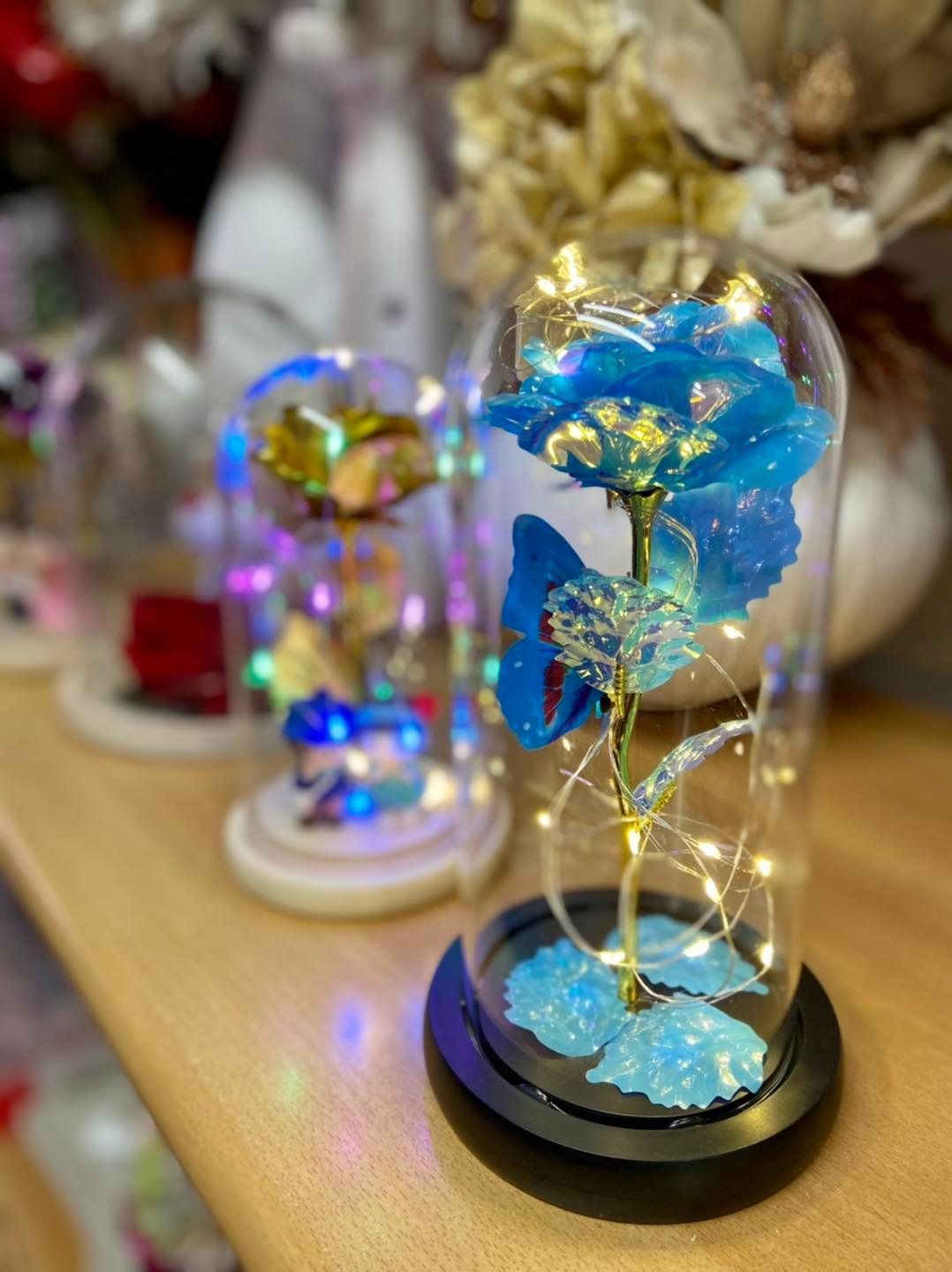 Coloured flowers in glass