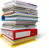 A stack of binders with paperwork