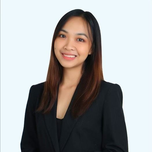 a woman wearing a black jacket is smiling .