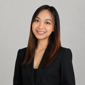 a woman wearing a black jacket is smiling .