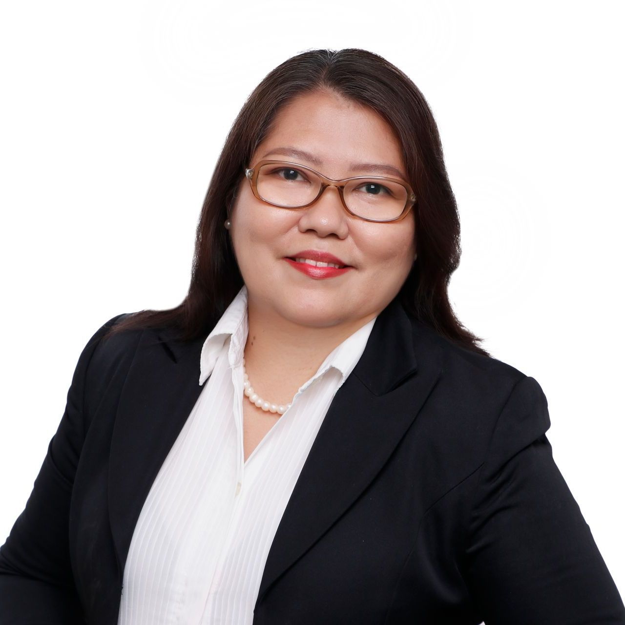 a woman wearing a pearl necklace and a black jacket