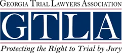 the logo for the Georgia trial lawyers association protecting the right to trial by jury
