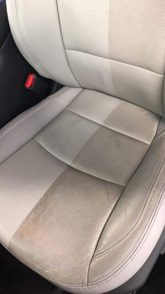 A close up of a car seat before and after being cleaned.