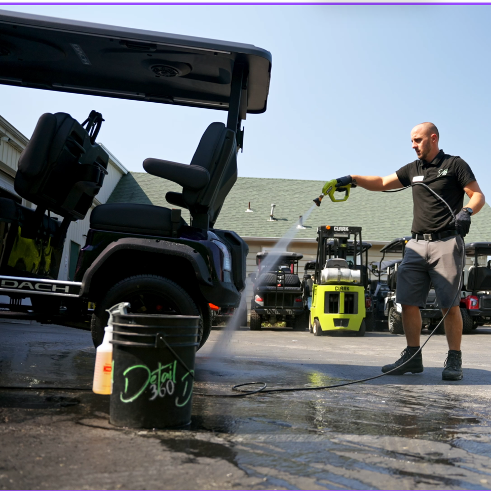 A blue sports car is parked on the side of the road.