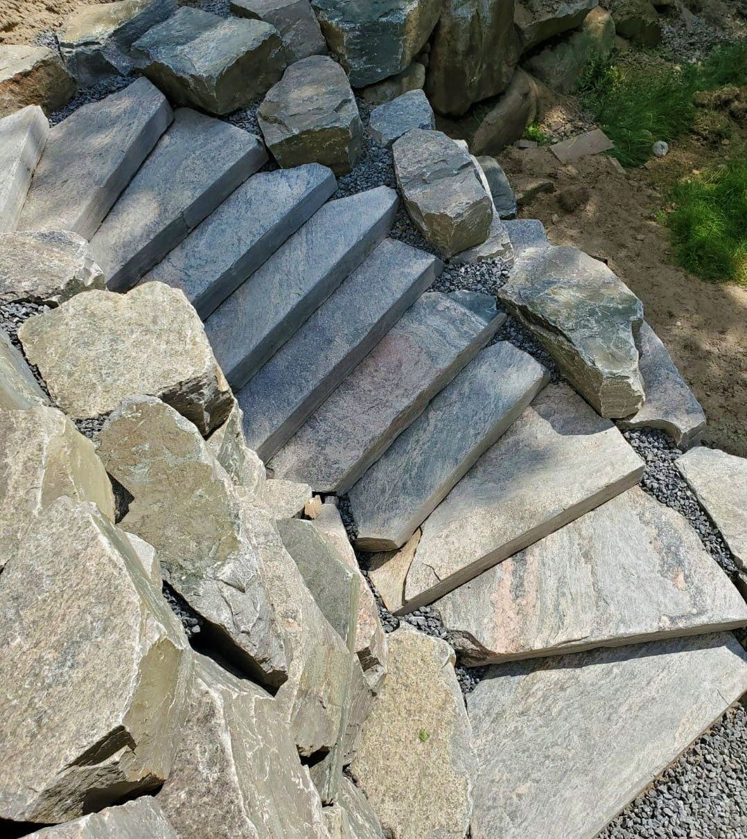 Rock retaining walls and granite stairs