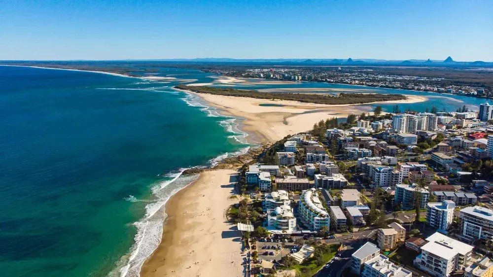 An Aerial View of Caloundra Beach With a City in the Background — Superstretch300 Limousines in Caloundra, QLD
