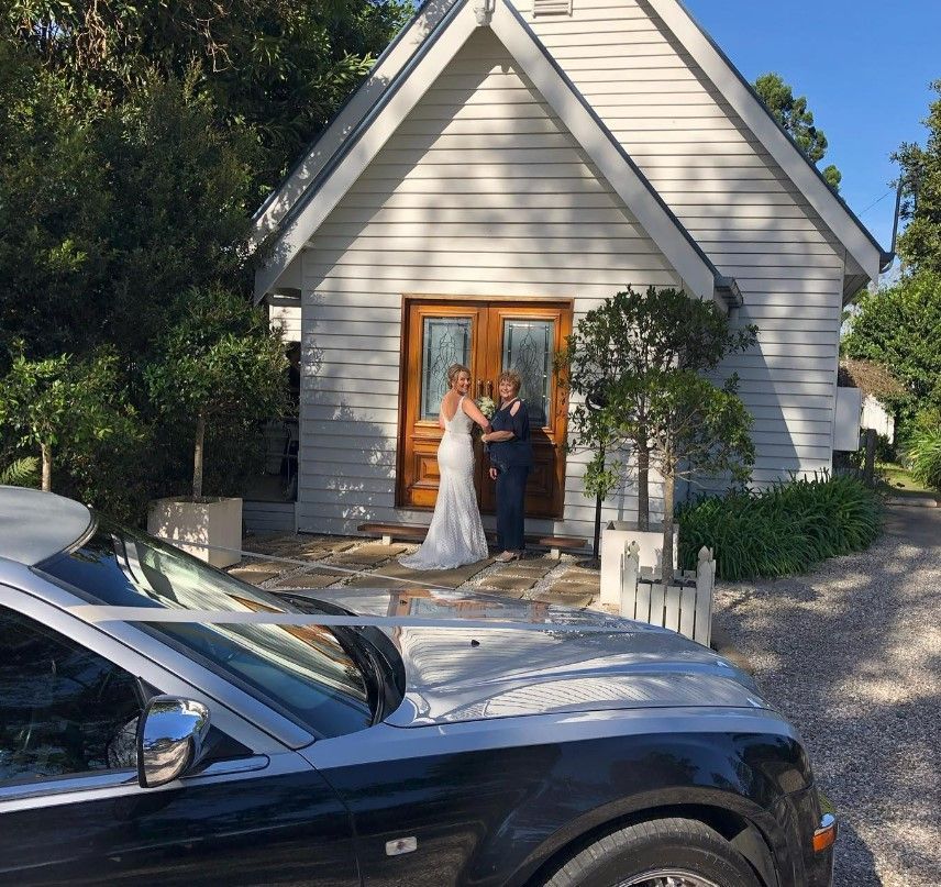 A White Car is Parked in Front of a Small Church — Superstretch300 Limousines in Sunshine Coast, QLD