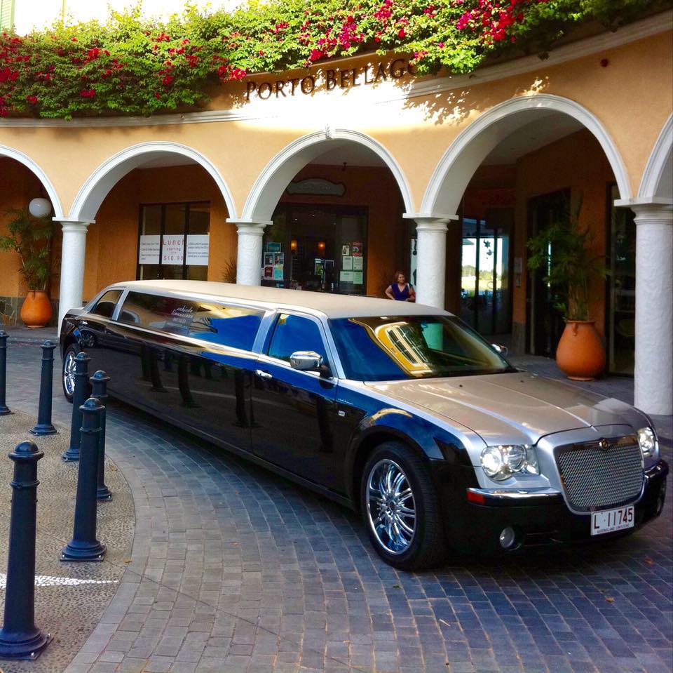 A Limousine is Parked in Front of a Building That Says Portugal — Superstretch300 Limousines in Sunshine Coast, QLD