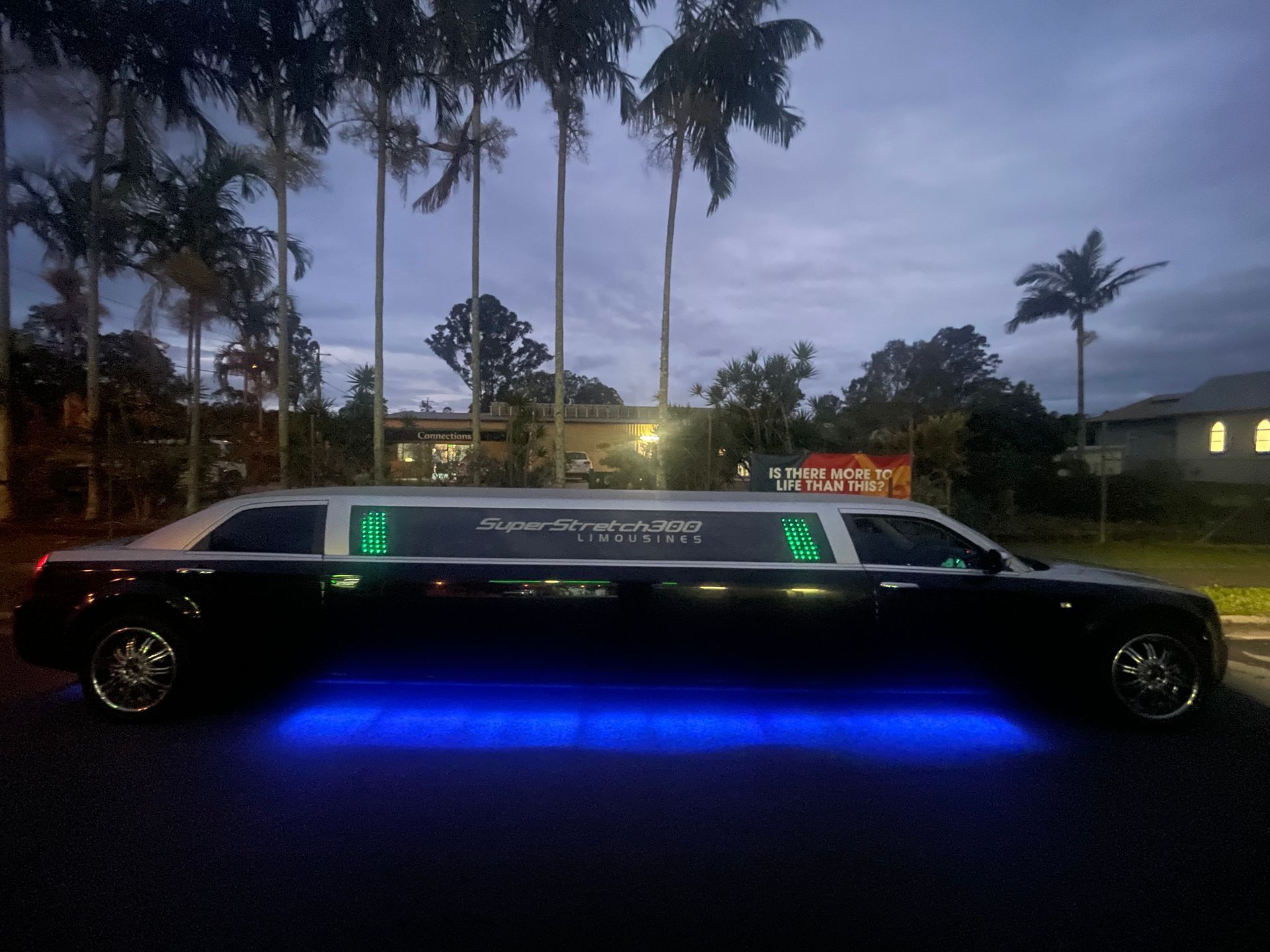Black Limousine With Blue Underglow Lights — Superstretch300 Limousines In Buderim, QLD