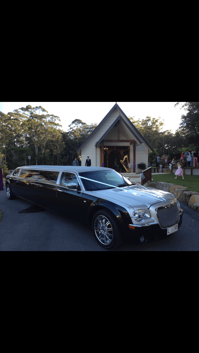 A Black Limousine is Parked in Front of a Church — Superstretch300 Limousines in Sunshine Coast, QLD