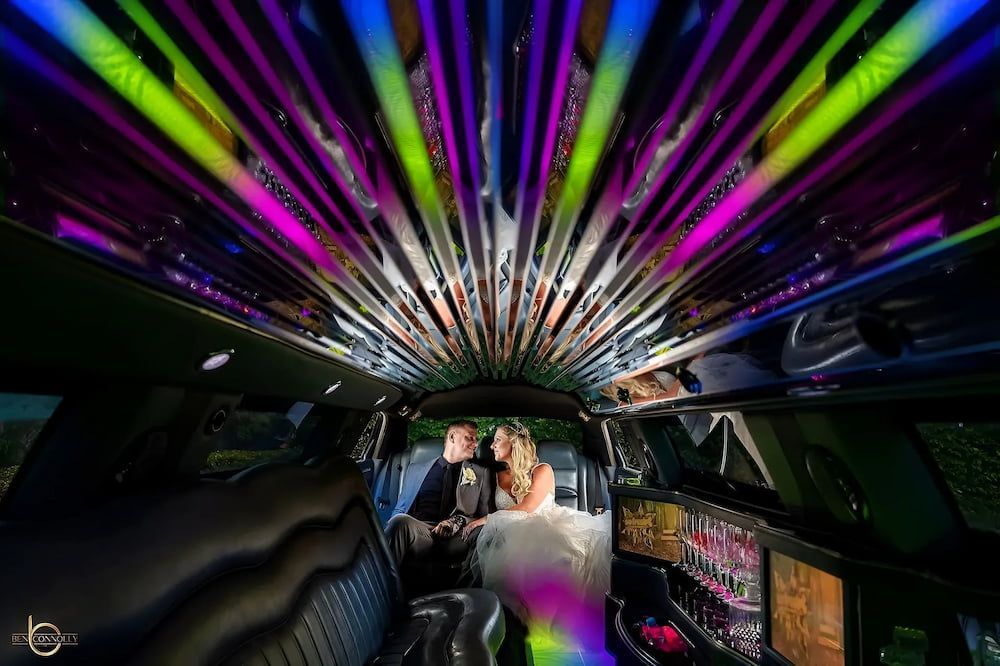Couple Having a Wine Inside the Limousine — Superstretch300 Limousines in Sunshine Coast, QLD