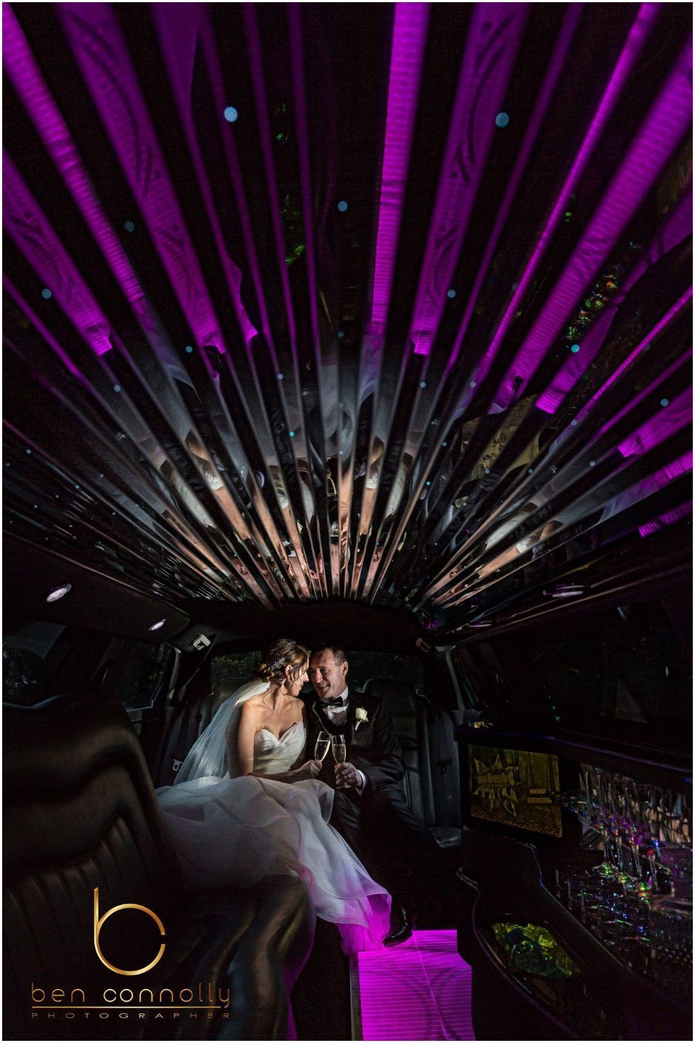 A Bride and Groom Are Sitting in the Back of a Limousine — Superstretch300 Limousines in Sunshine Coast, QLD