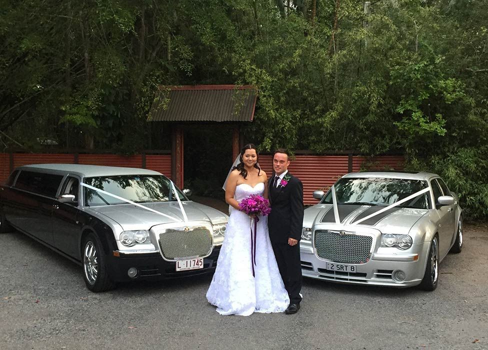Happy Wedding Couple on the Background of a Limousine — Superstretch300 Limousines in Sunshine Coast, QLD