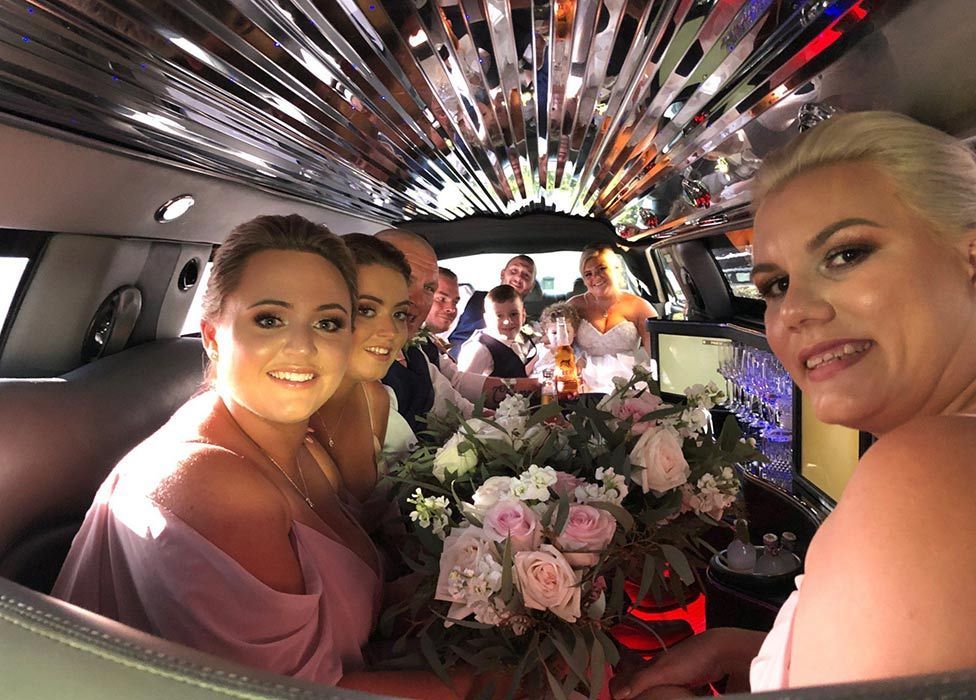 Wedding Couple and the Brides Maid Inside the Limousine — Superstretch300 Limousines in Sunshine Coast, QLD 