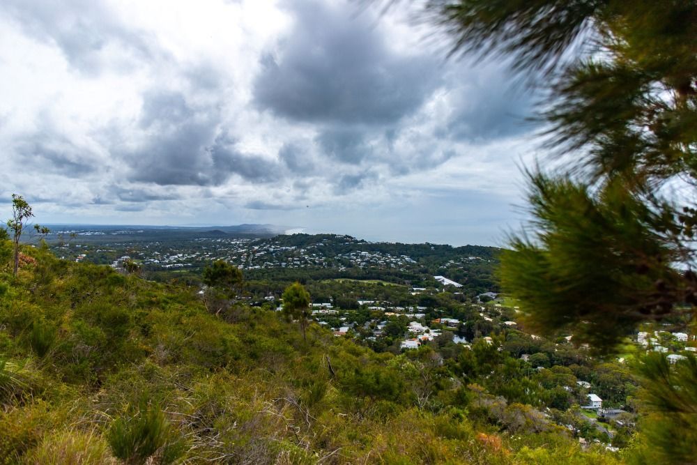 Overlook Of A Coastal Town Under A Cloudy Sky — Superstretch300 Limousines In Coolum, QLD