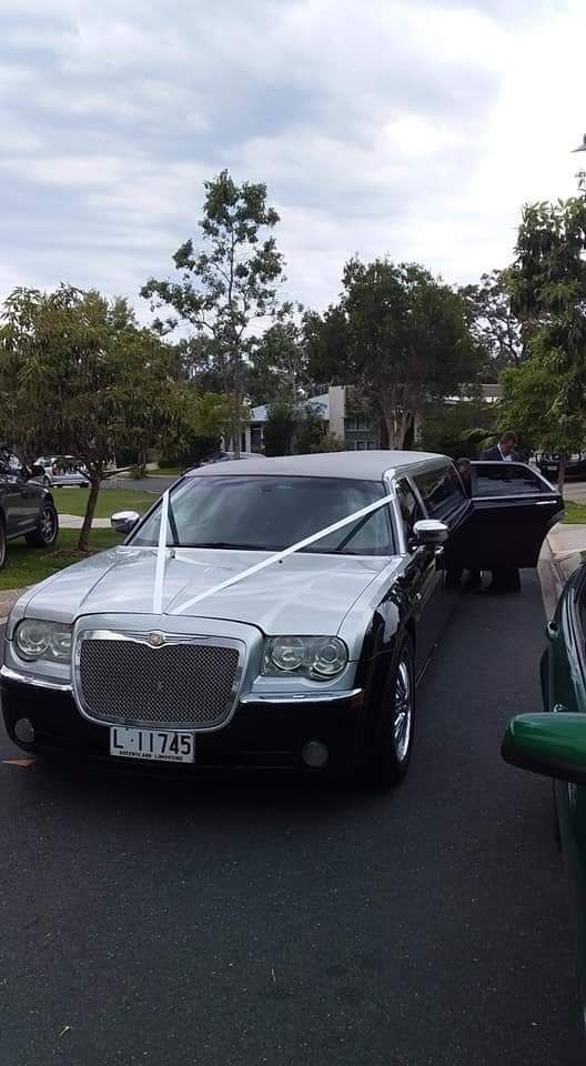 Silver and Black Limousine Parked, Decorated With White Ribbons — Superstretch300 Limousines in Sunshine Coast, QLD