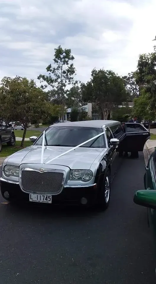 Silver And Black Limousine With White Ribbon — Superstretch300 Limousines In Caloundra, QLD