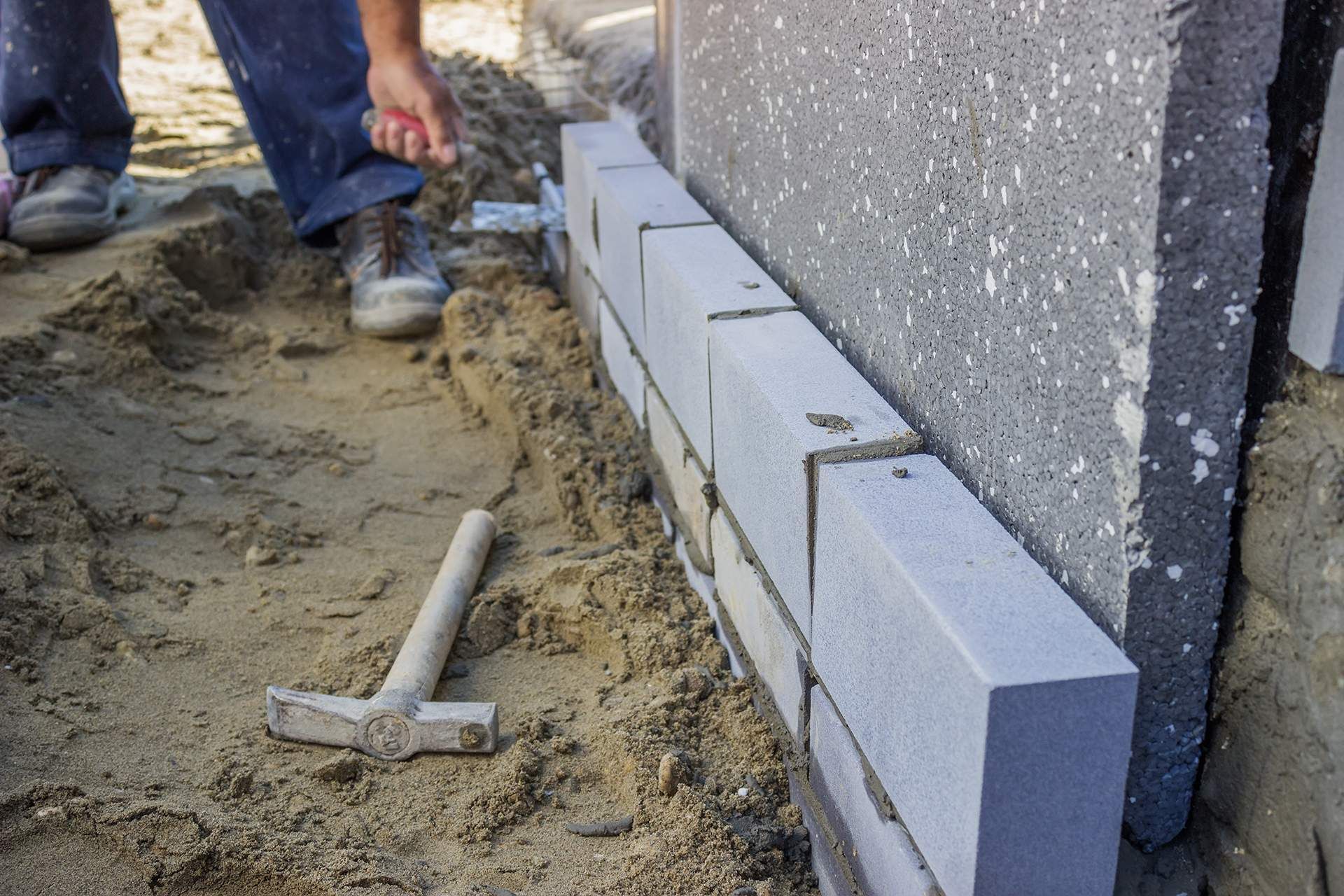 Builder worker installing insulation layer