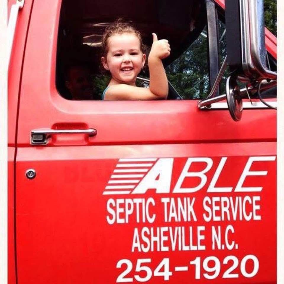 Girl smiling from septic truck | Asheville, NC | Able Septic Tank Service Girl smiling from septic truck | Asheville, NC | Able Septic Tank Service