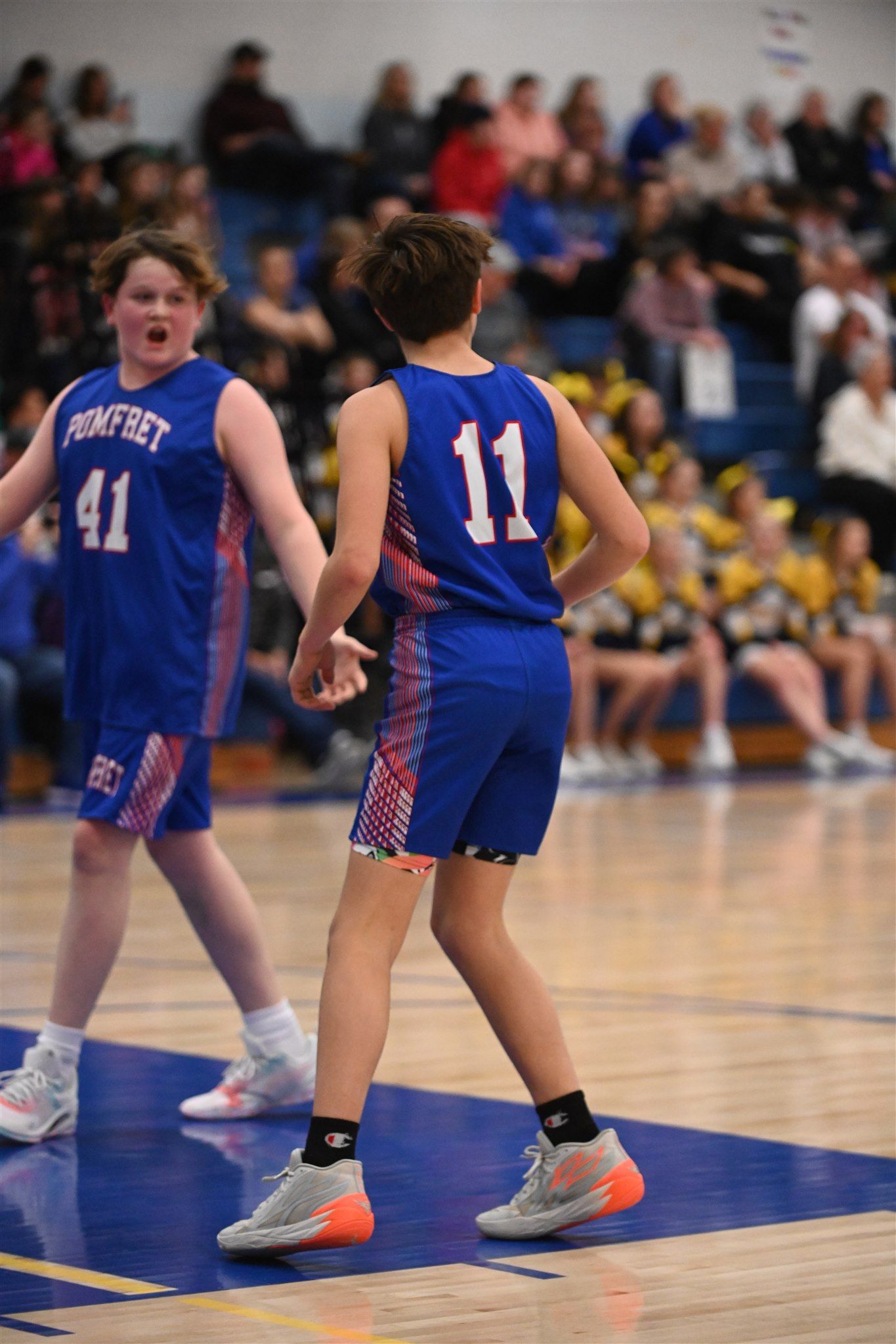 members of the 2023-24 boys basketball team on the court