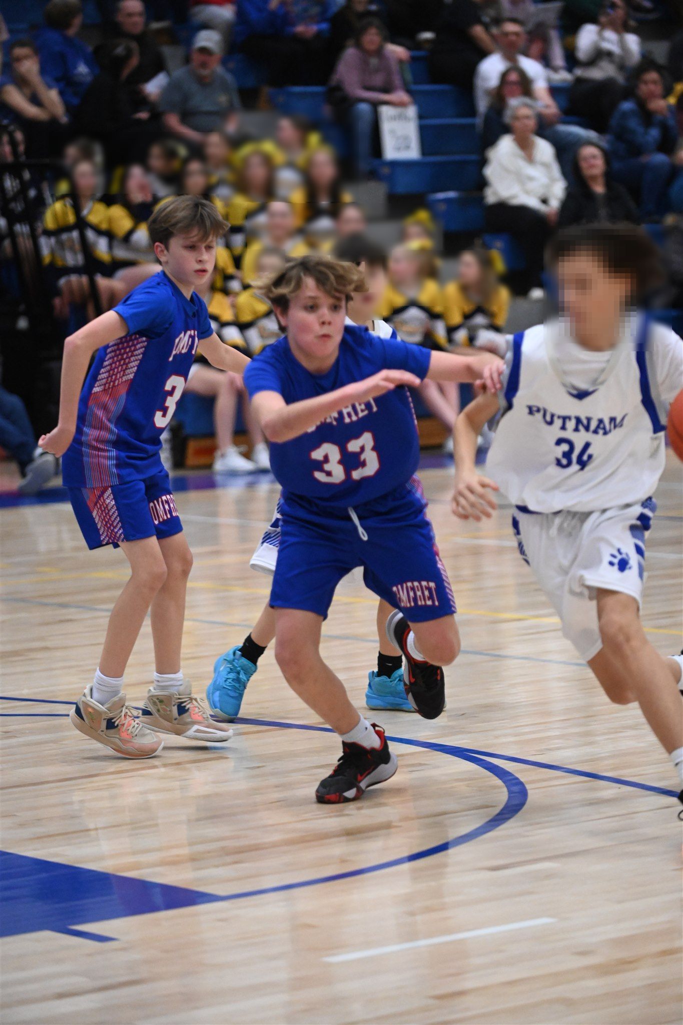 members of the 2023-24 boys basketball team on the court