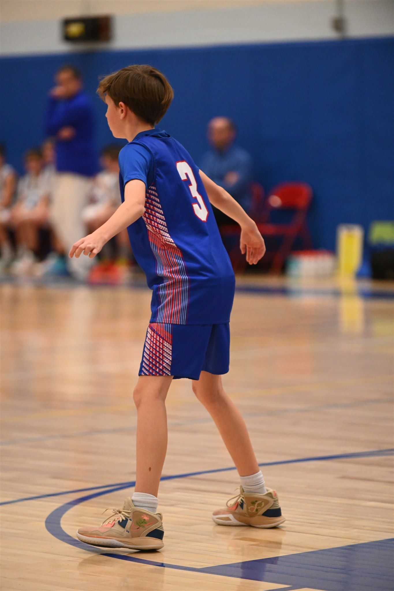 member of the 2023-24 boys basketball team on the court