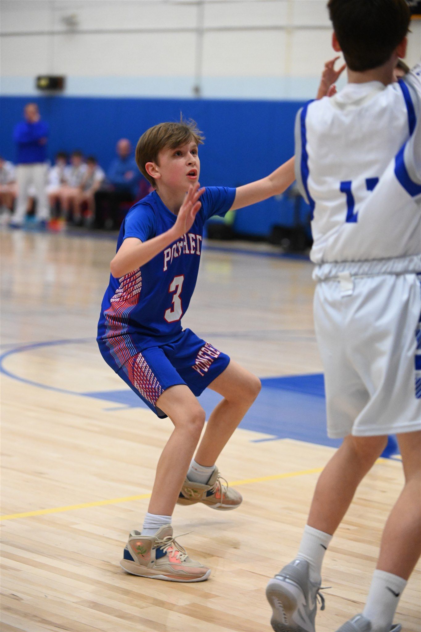 member of the 2023-24 boys basketball team on the court